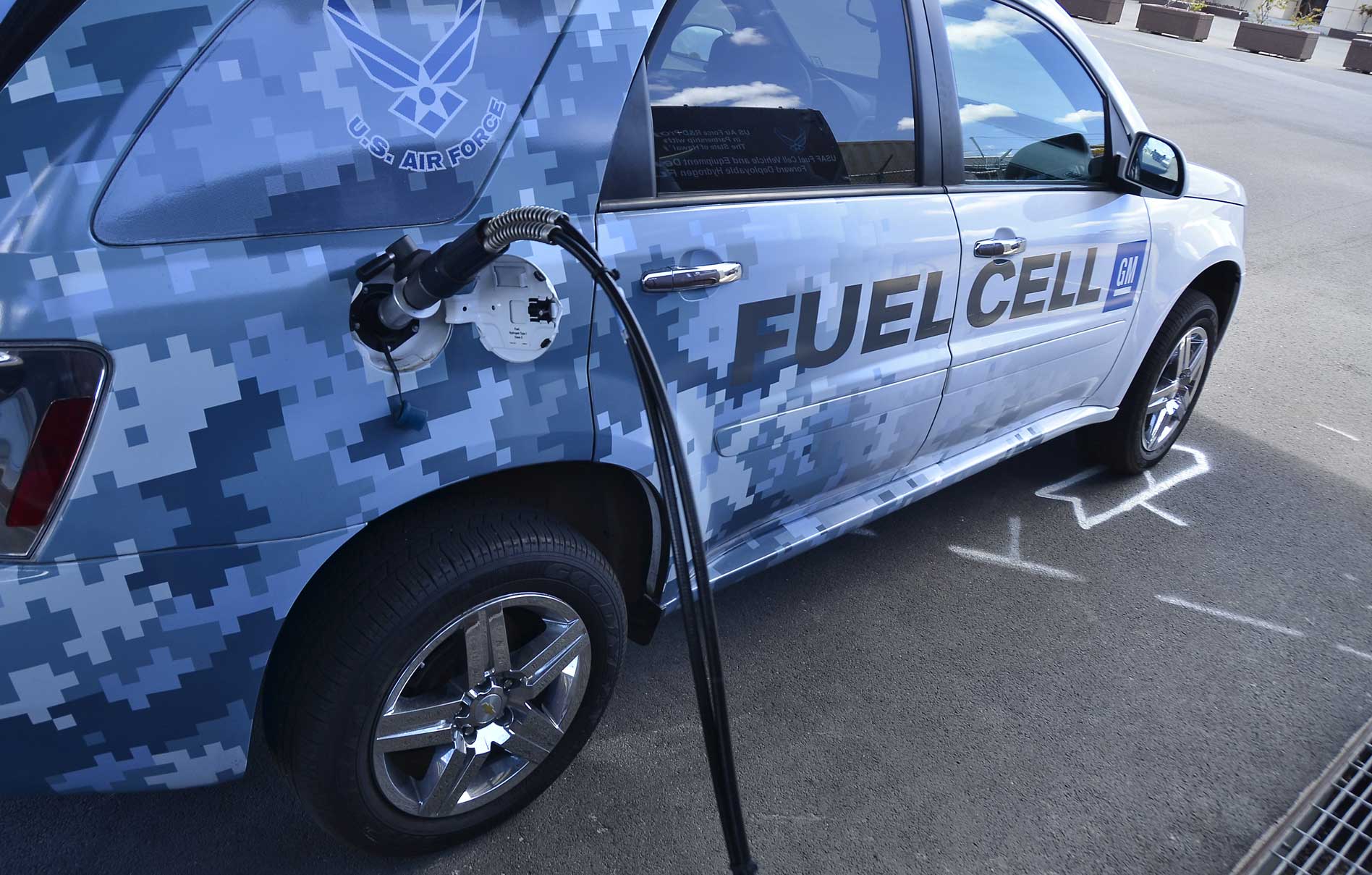 A hydrogen-powered car refuels in Hawaii