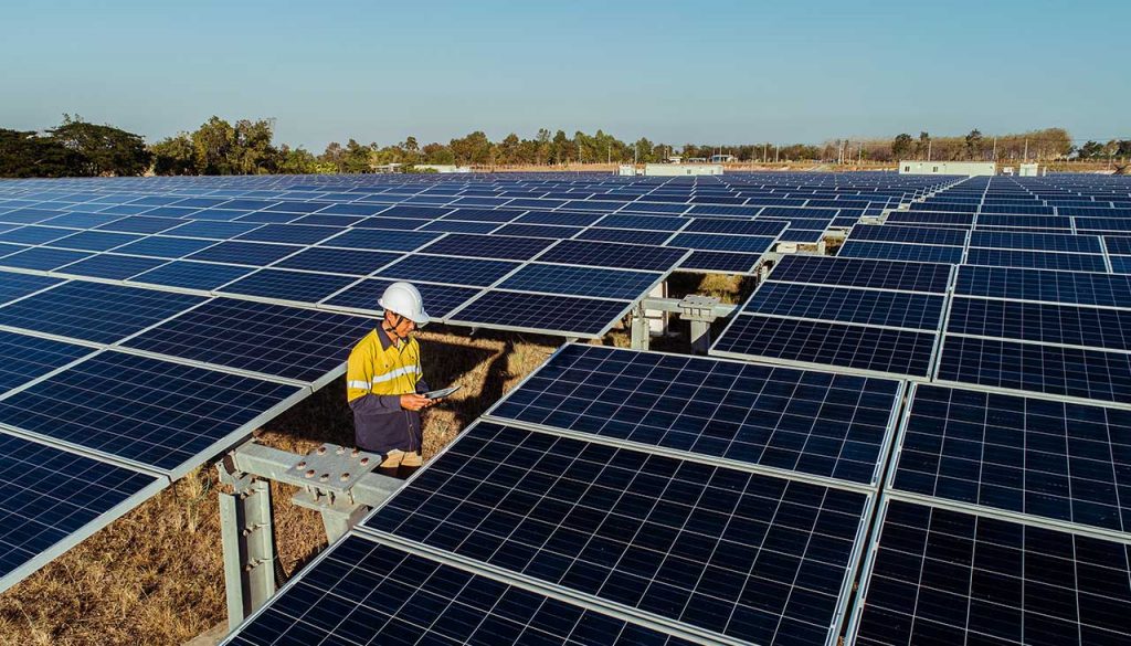 Worker at the large-scale solar farm at Emu Downs