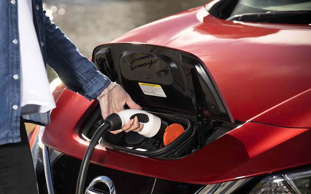 Electric vehicle connected to charger feature image