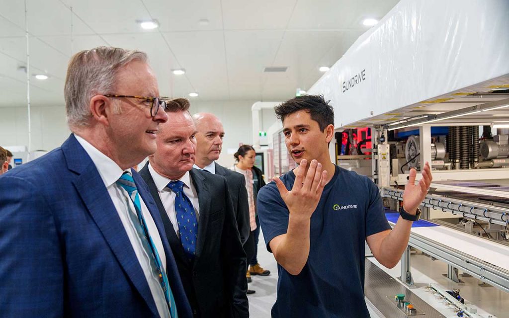 SunDrive CEO Vice Allen explains SunDrive's technology to (from left) Prime Mister Anthony Albanese, Minister for Climate Change and Energy Chris Bowen, ARENA CEO Darren Miller (Image: SunDrive)